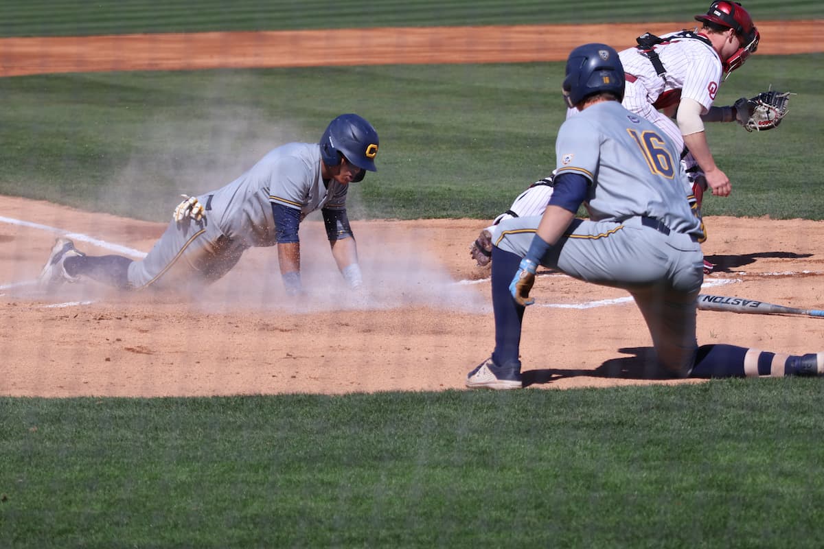 Cal scores a run against OU in game one